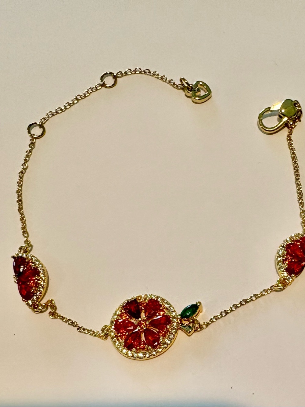 TORY BURCH 18k-Gold plated orange-Red Crystal Flower Bracelet with Green Accent